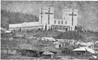Newspaper photo from 1975 of the Tabernacle Temple building seen from a distance on a hillside above low houses, with a large cross on each of its two towers.